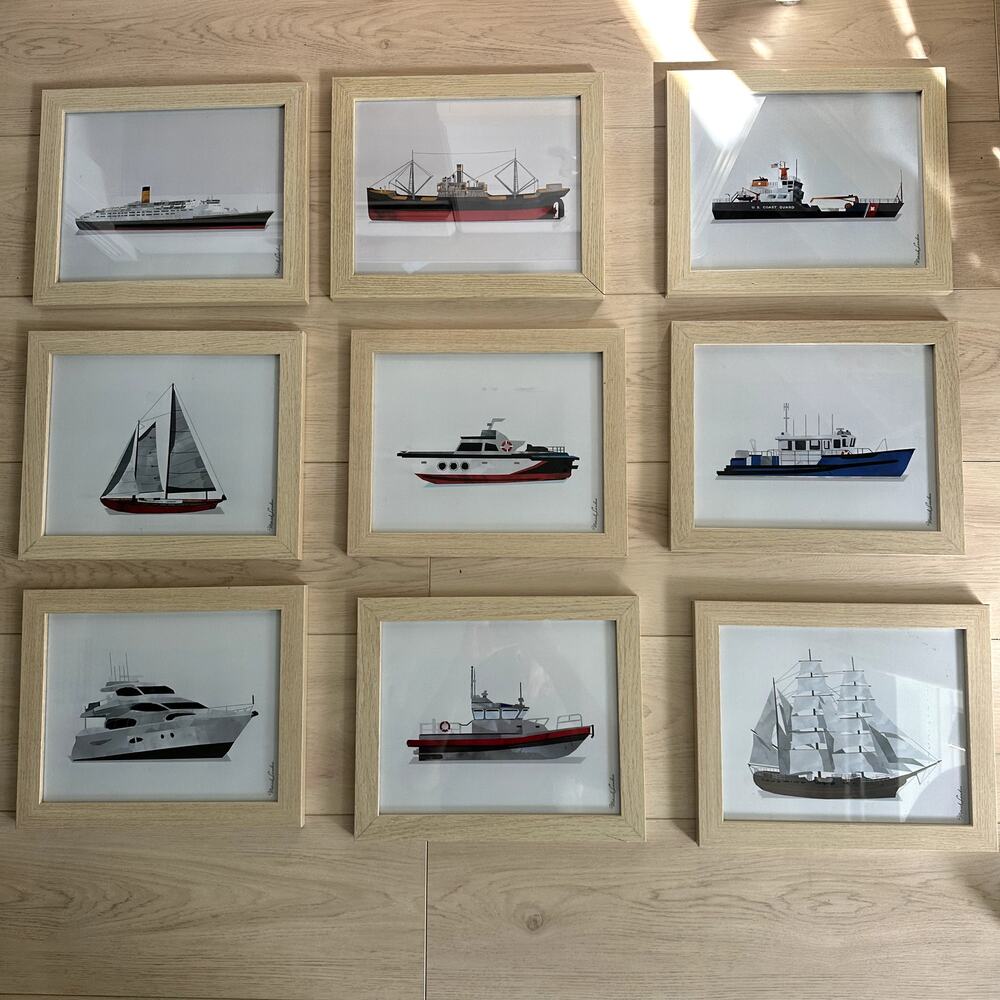 Gallery wall of nine 8x10 photo frames with boat prints